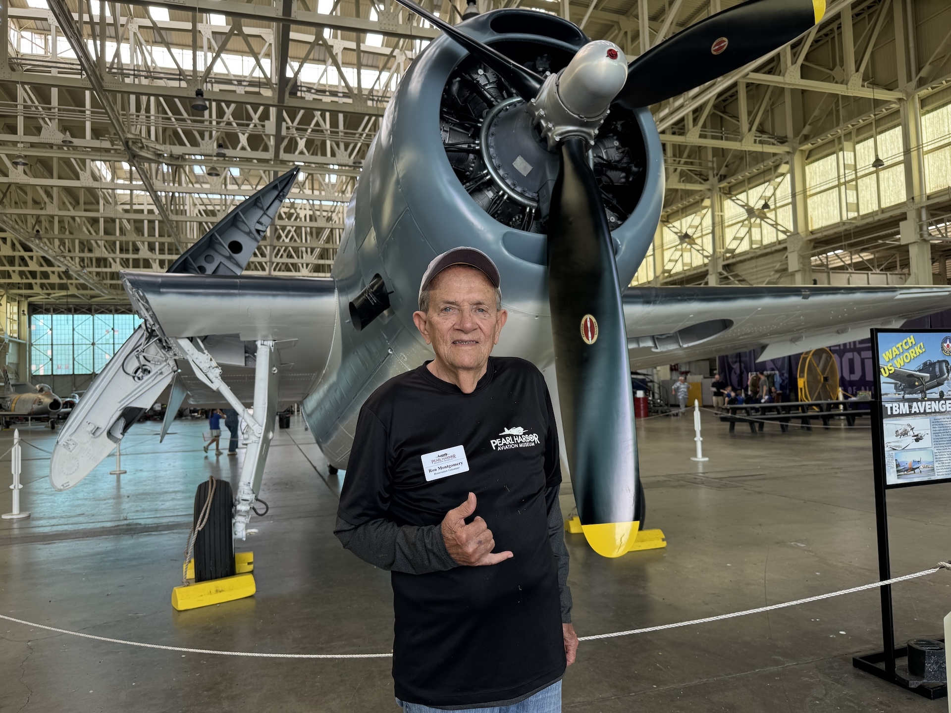 Montgomery stands in front of a PHAM exhibit of a TBM Avenger, which he helped restore. This is the same type of aircraft that former President George H. Bush flew as a Navy fighter pilot in World War II. Credit: PHAM.