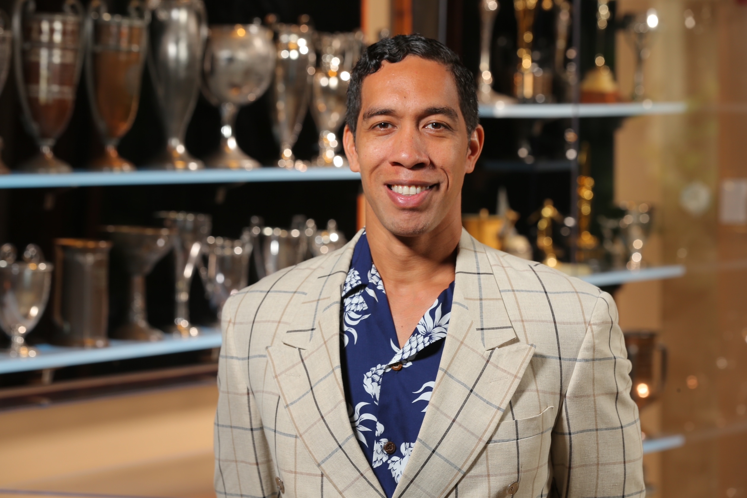 Actor Moses Goods with awards won by Duke Paoa Kahanamoku.