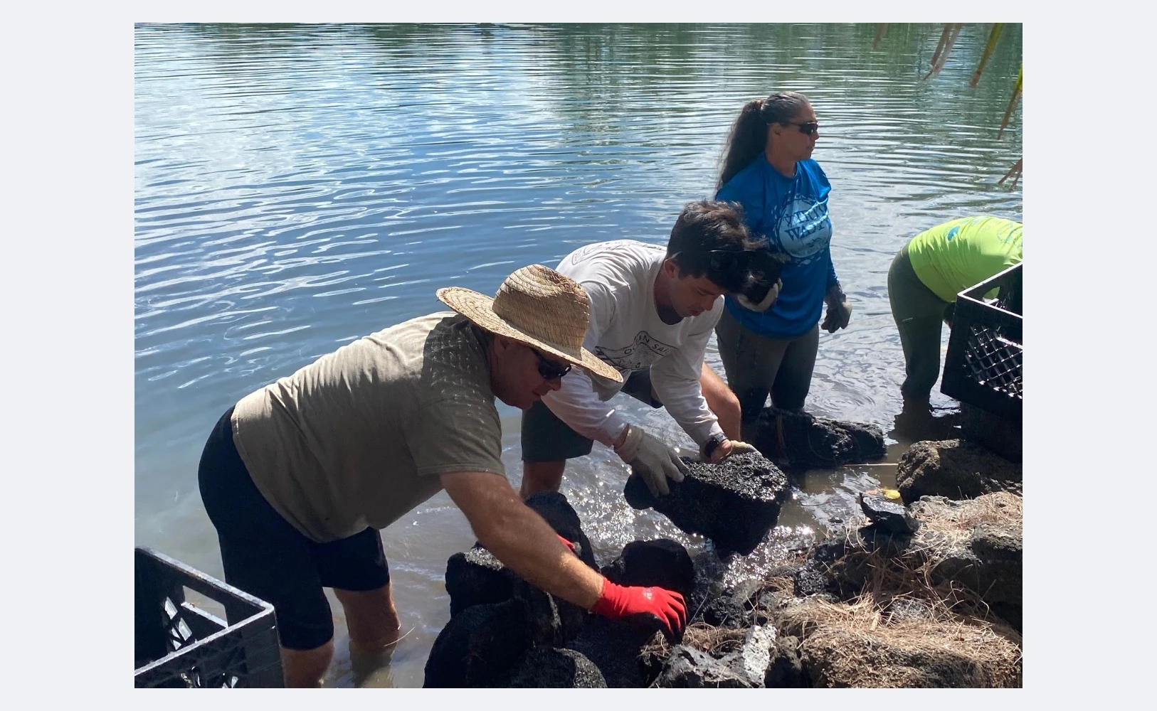 First responders work to restore a fishpond as part of a study by Vibrant Hawaiʻi called No Nā Pua.