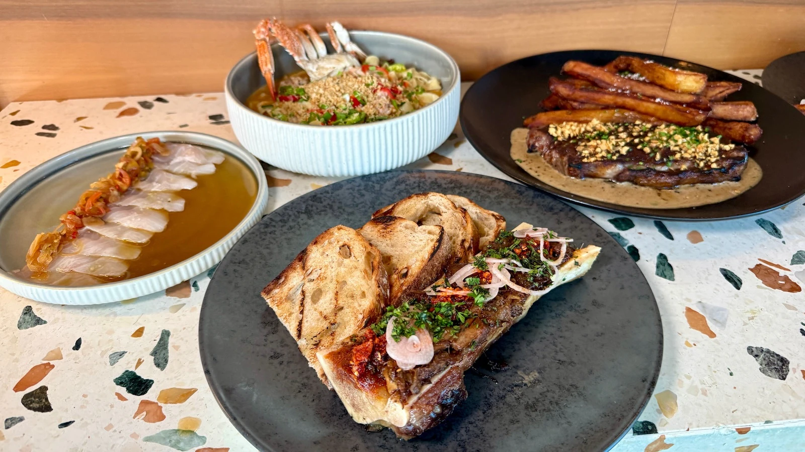 pho roasted bone marrow, chili crab noodles, steak