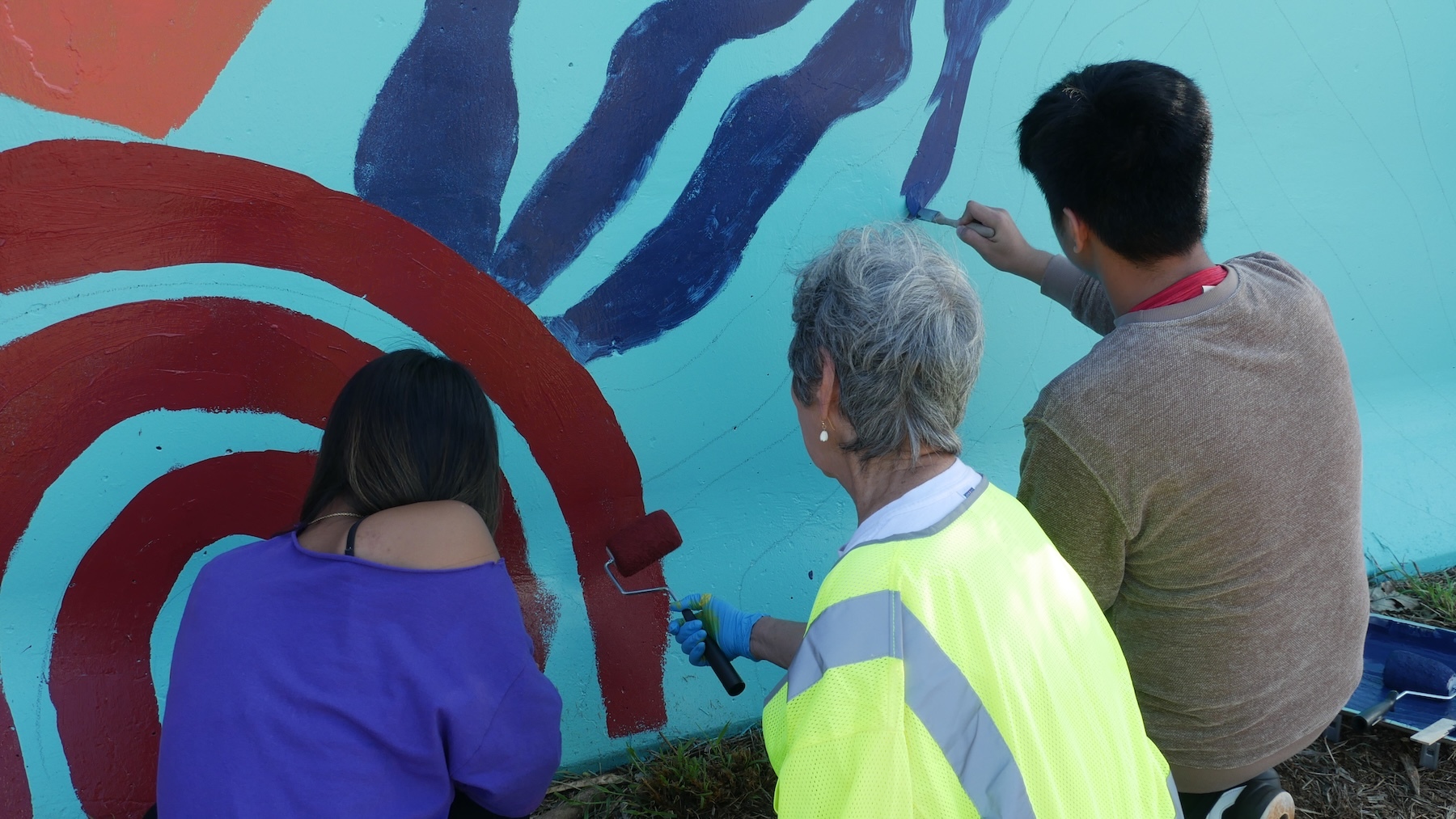 Students from each high school painted a section of the mural.
