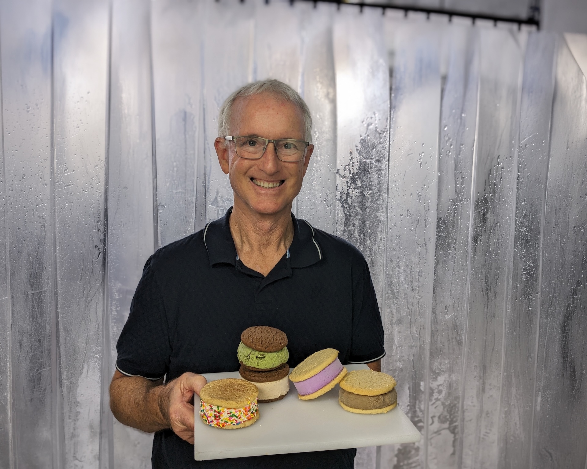 Logan displays five different flavors of Uncle’s Ice Cream Sandwiches.