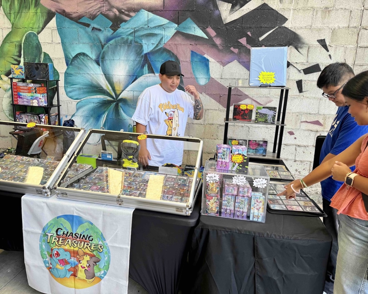 Though the flyer says more than 50 vendors, there were closer to 70 vendors at the inaugural Keep it Aloha Card Show on May 2-3, per host Hawaiʻi Collectibles. Pictured here is Chasing Treasures (@hi.chasingtreasures). PC: Kelsey Kukaua Medeiros