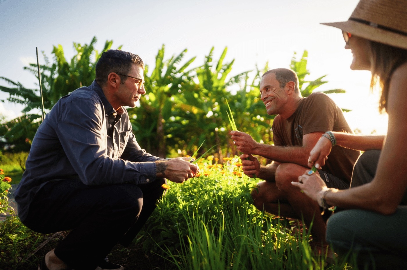 "DIRT" host Josh Rosen, left, met with Kim and Jack Johnson at their Kōkua Learning Farm in February, ahead of the devastating Kona lows that hit the Islands, particularly Oʻahu's North Shore community.