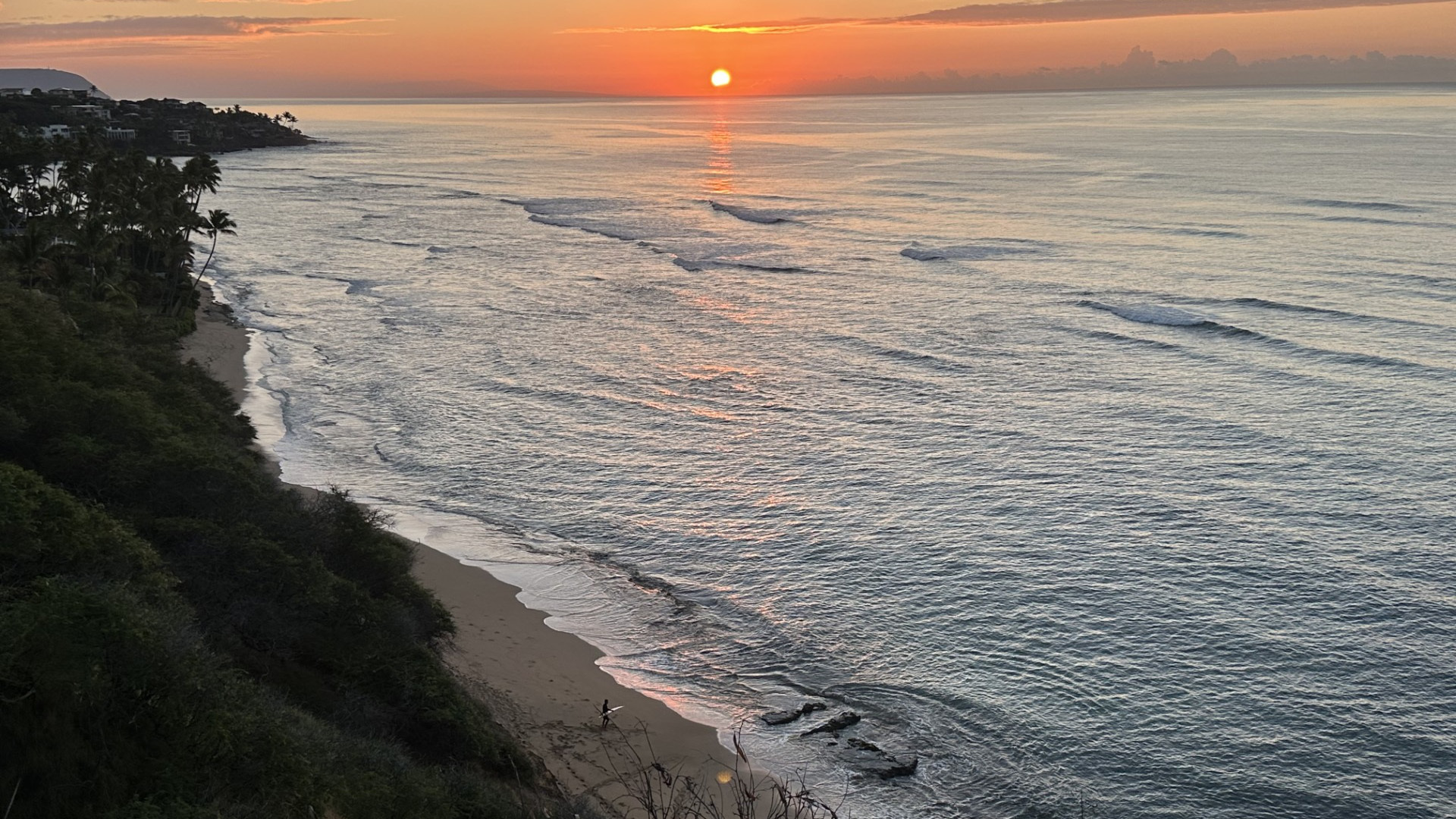 Surfer about to go in the water at Diamond Head Beach