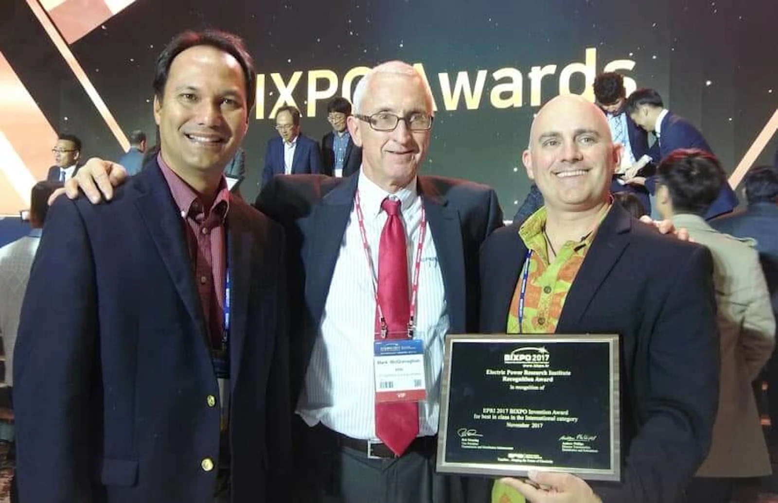 At BIXPO in South Korea, the world's largest energy conference, Shifted Energy was awarded the prestigious “Best in Class: International Category” for their Grid Maestro software solution. Pictured are Shifted Energy’s Olin Lagon, left, and Forest Frizzell, right. The award was presented to them by EPRI Vice President of Innovation Mark McGranagham, center.