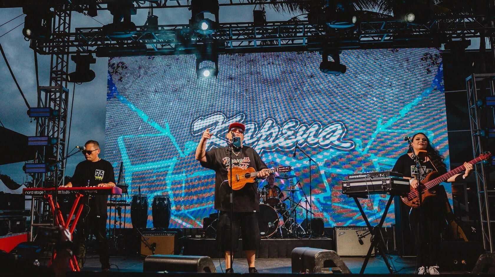 Kelly Boy De Lima, center, performs with the band Kapena, which includes his son, Kapena, on keyboards and vocals; his daughter, Lilo, on bass, and his grandson, Kapena-Uriah, on drums.