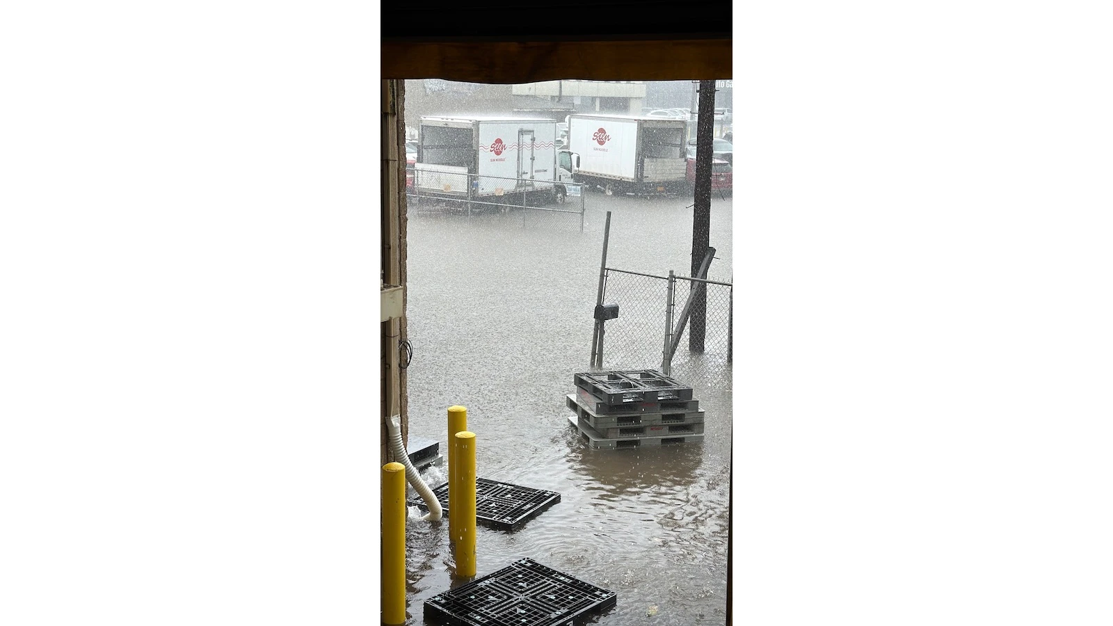 heavy rain and delivery trucks
