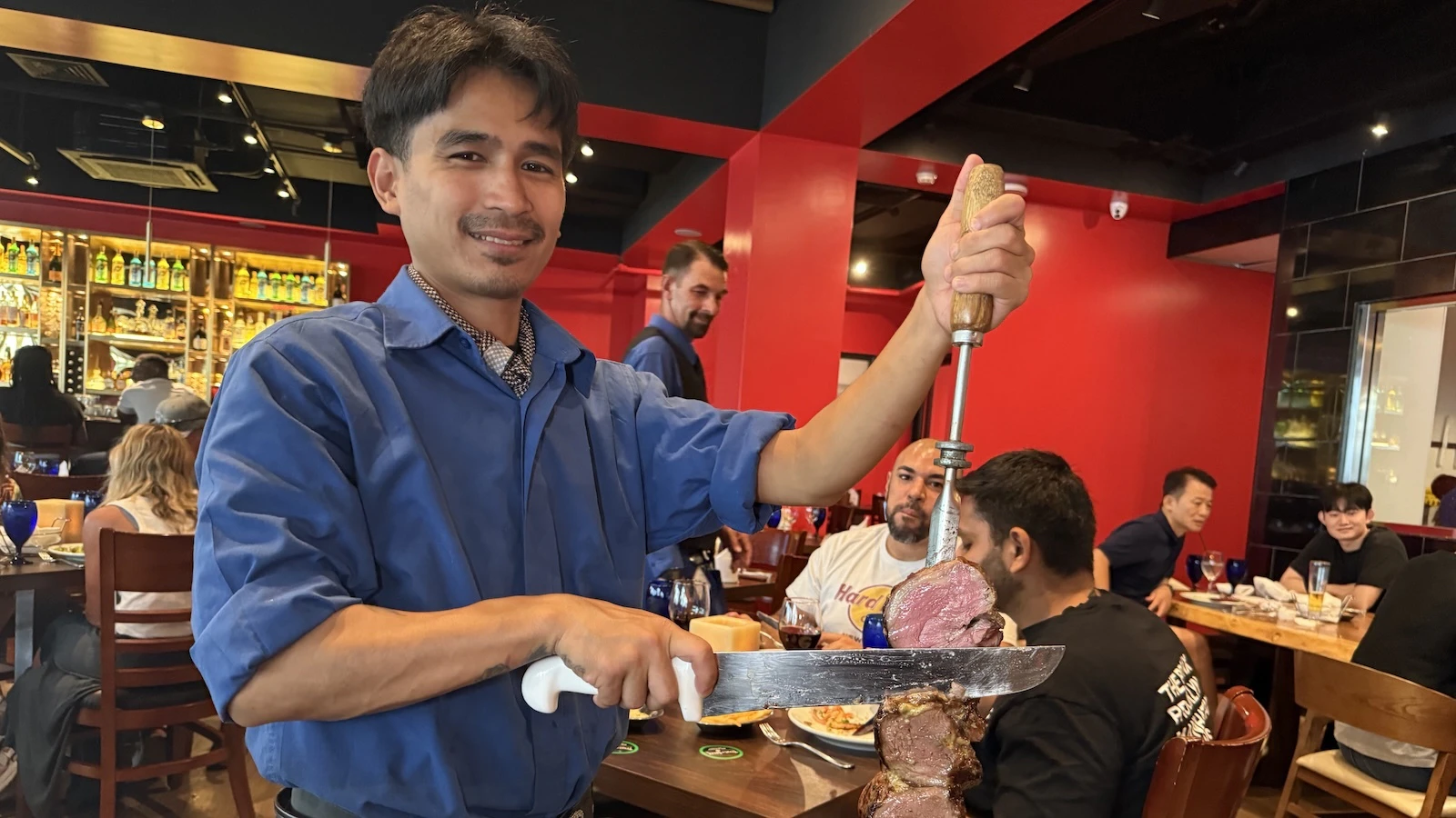 server holding meat