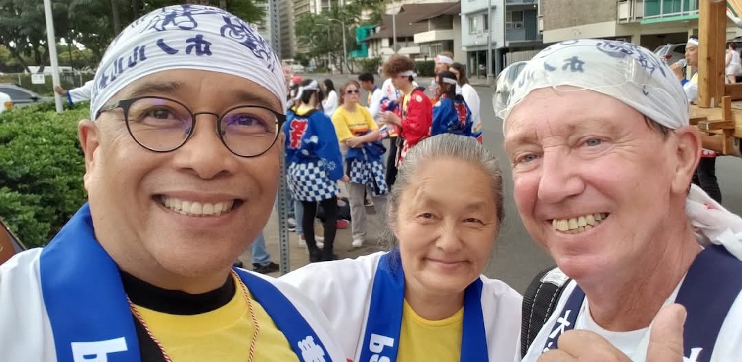 Three Honolulu Festival volunteers.