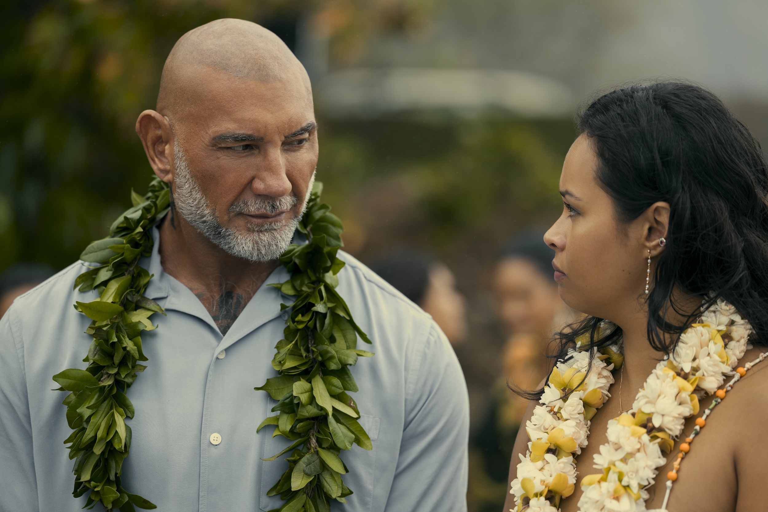 James Hale (Dave Bautista) and his cousin, Nani (Frankie Adams), speak during a funeral held at the beach.