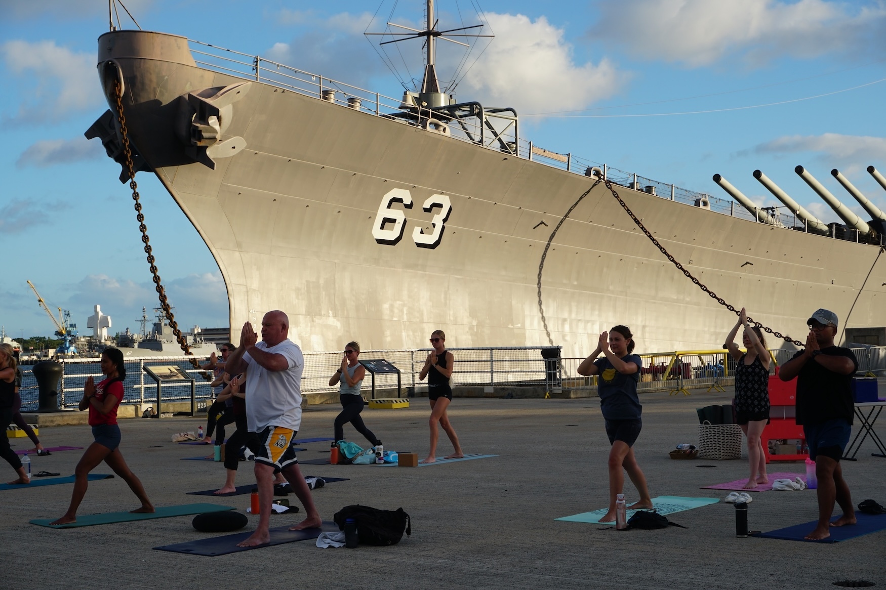 A yoga session on the pier near the Battleship Missouri Memorial.