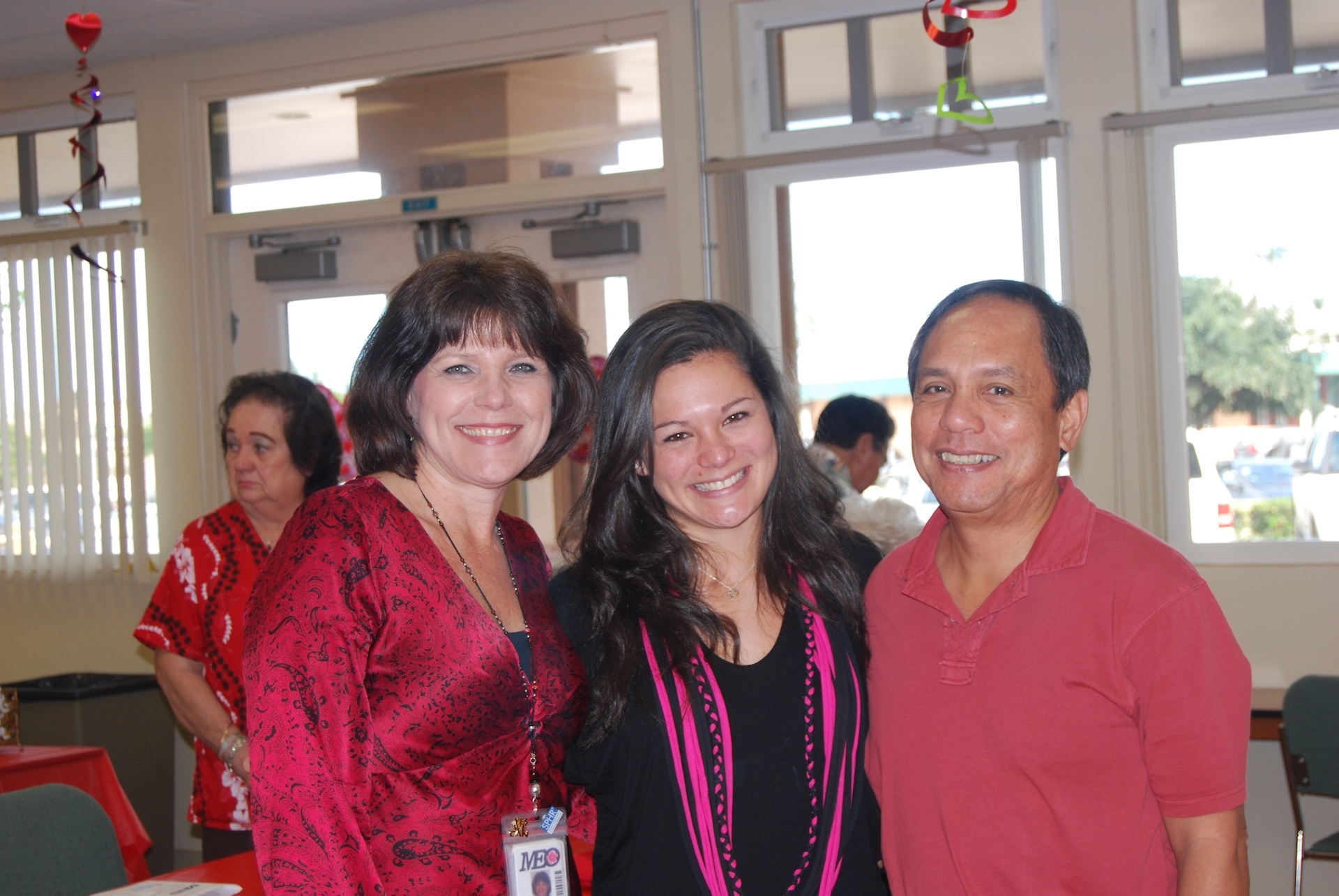 From left, Debbie Cabebe, pictured with her daughter, Courtney, and husband, Raymond, at one of MEO's Annual Volunteer Luncheons.