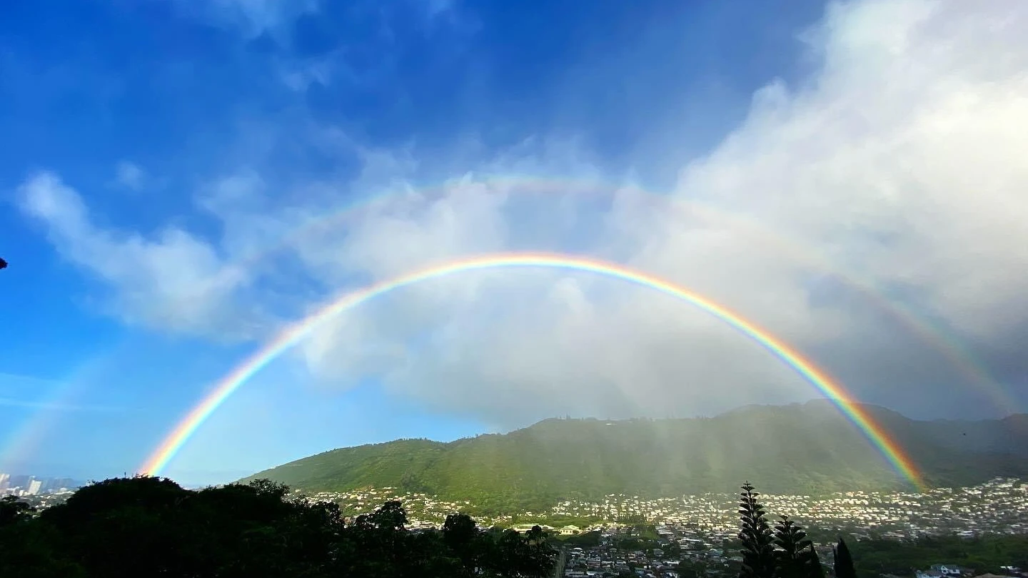 A double rainbow across the sky
