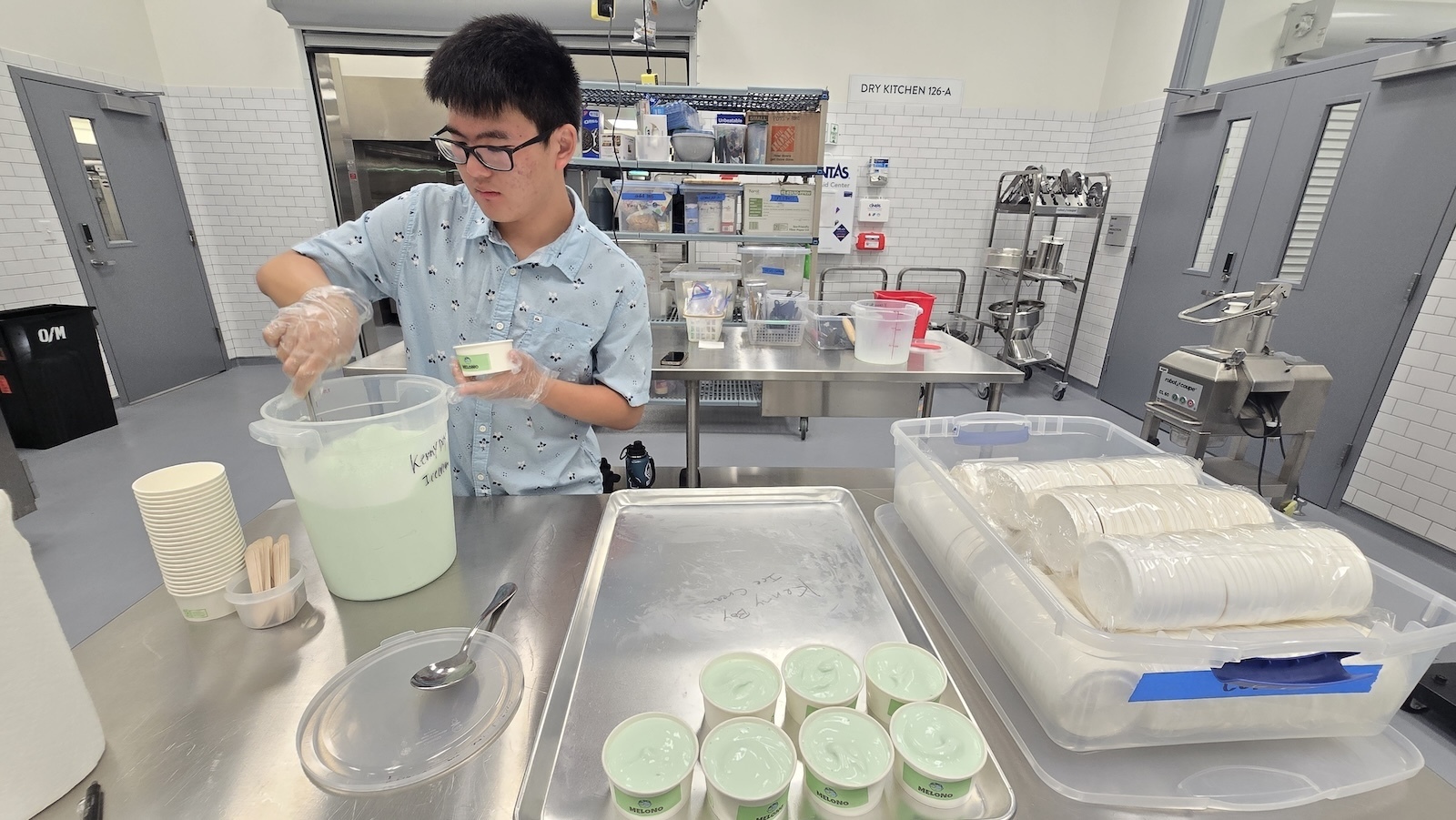 Kenny Tsuru, the name and driver behind Kenny Boy Ice Cream, packages his Melono ice cream.