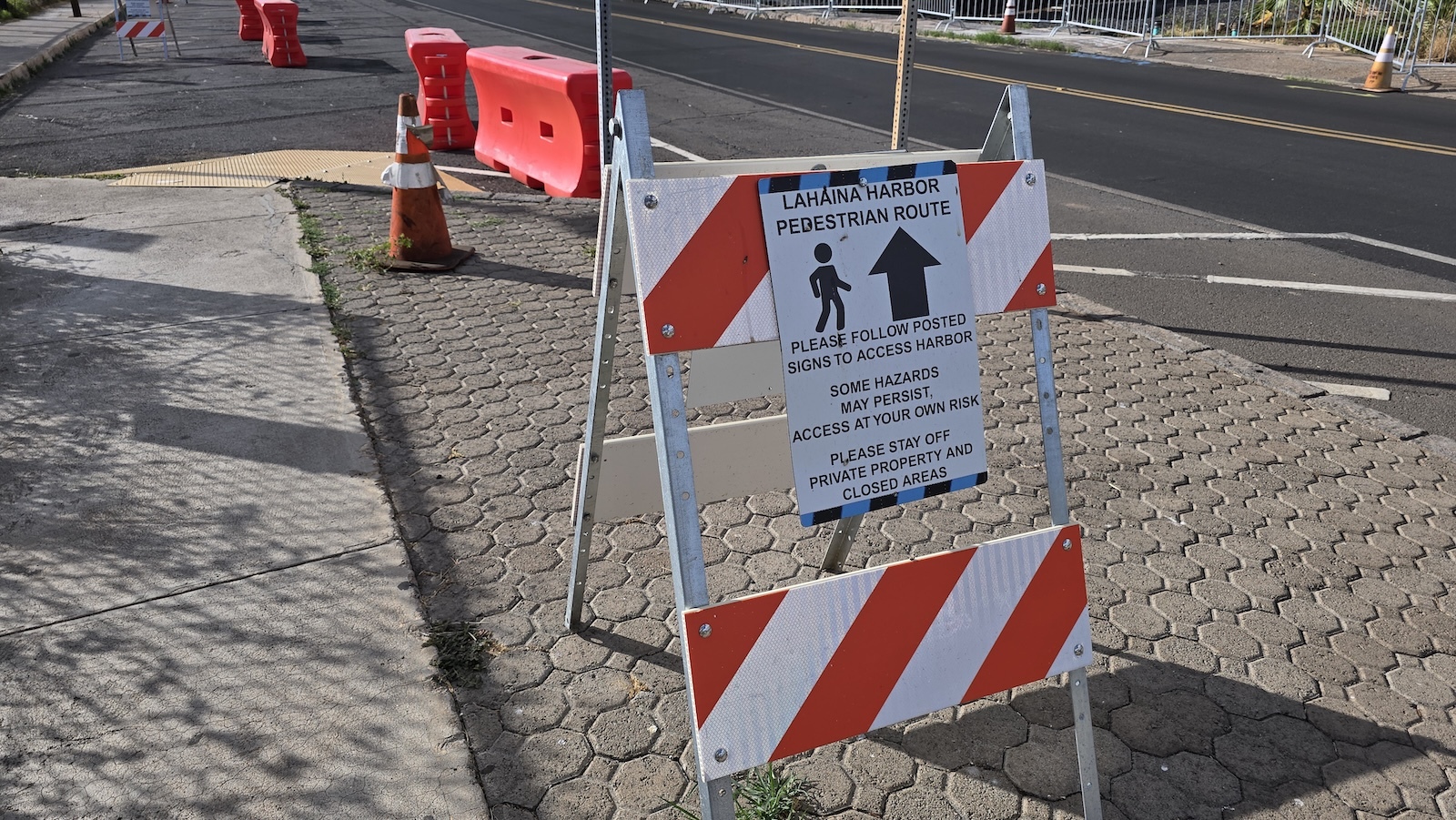Signage in Lahaina directing pedestrians to the harbor.