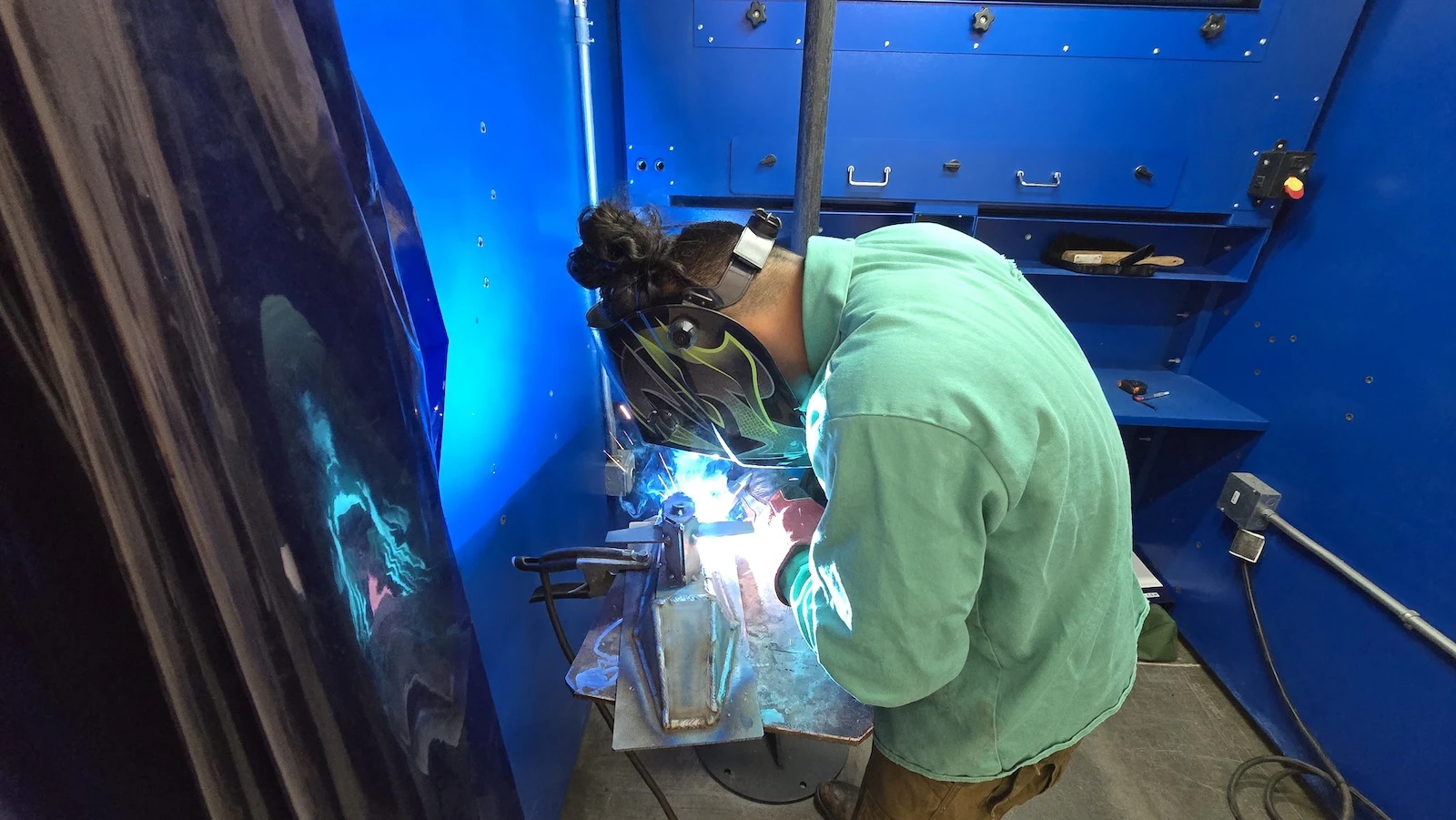 A student welds.