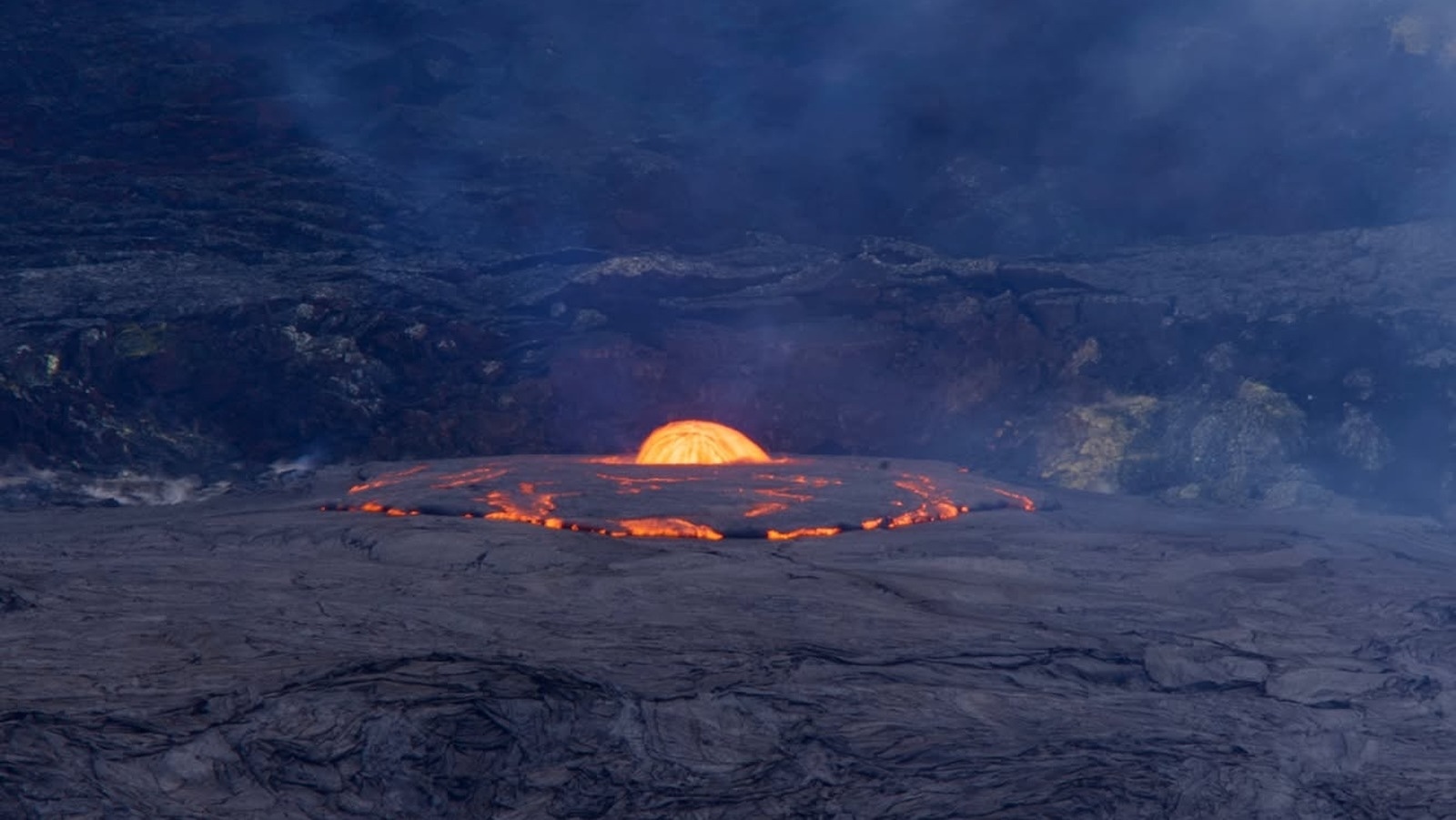 A shot of the a vent dome fountain early Thursday morning, with volcanic gas thick above the lava.