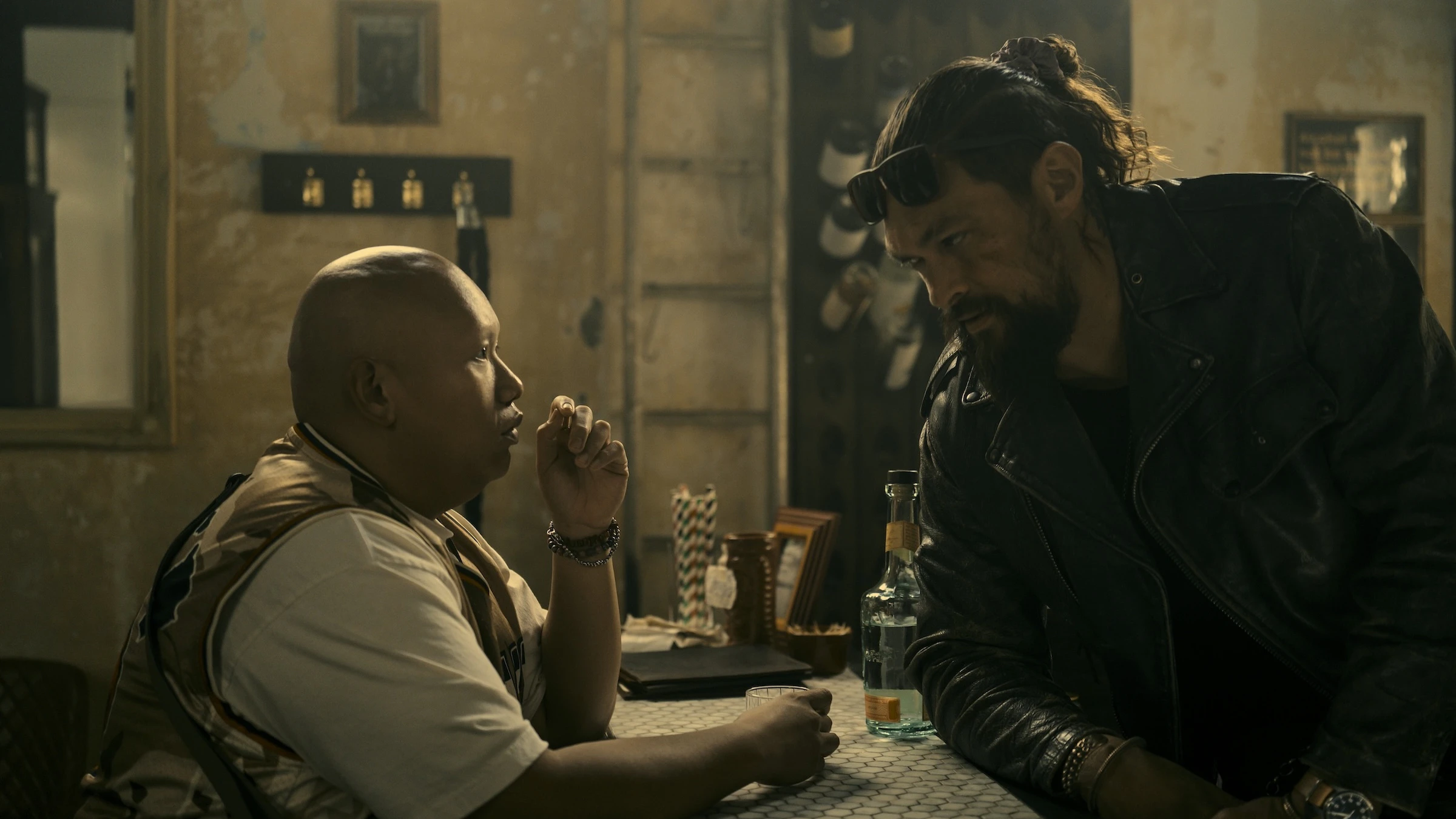 Jacob Batalon, left, plays Pika, who joins Jonny Hale (Jason Momoa) in a quest to figure out who killed Hale’s father.