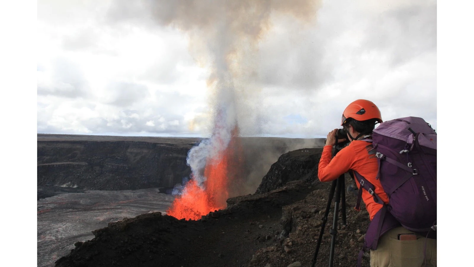 A USGS Hawaiian Volcano Observatory geologist takes measurements of the fountain heights during episode 15 of the Kīlauea summit eruption in Halema‘uma‘u.