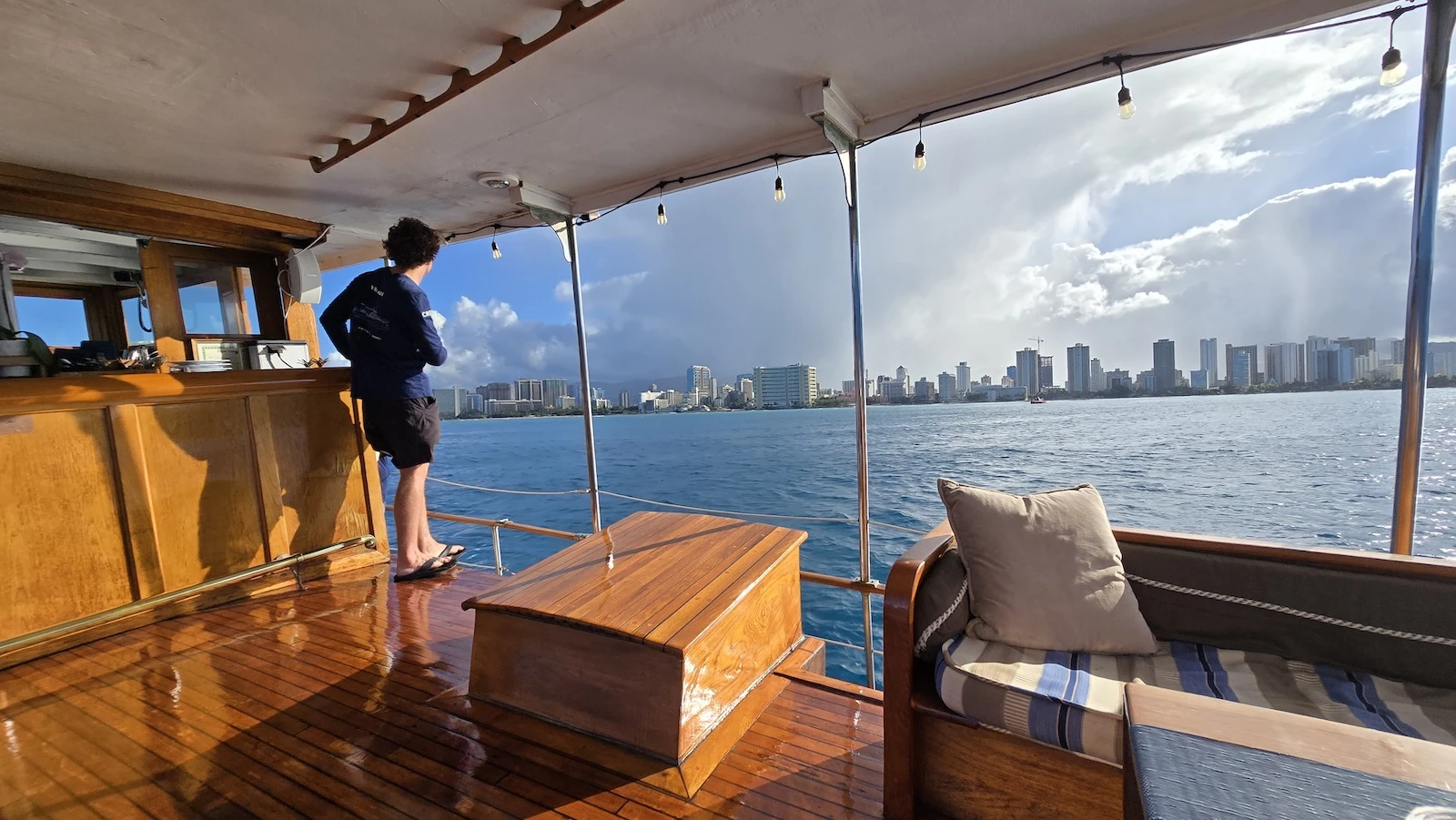 A crew member looks at the Honolulu coastline during a coffee cruise Friday, May 30.