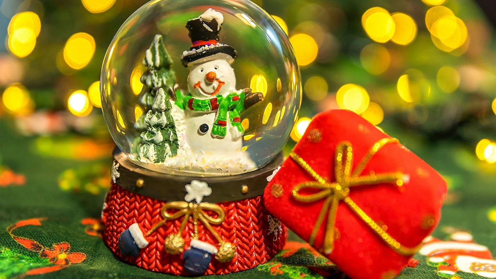 Holiday snow globe and decorations