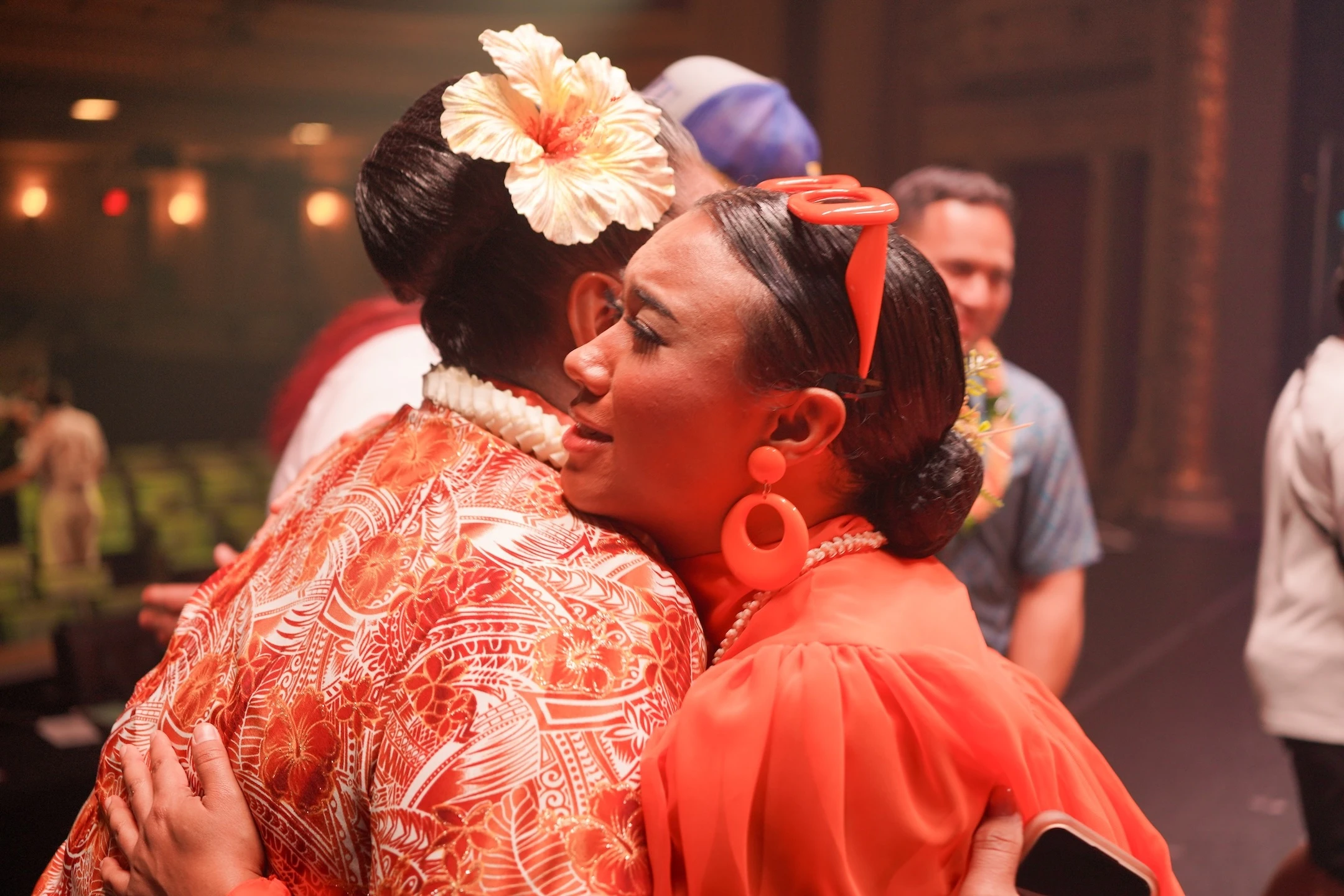T.J. Keanu Tario, who goes by the stage name Laritza, embraces Kumu Hina, one of the judges of “Hawaiʻi to the World.”