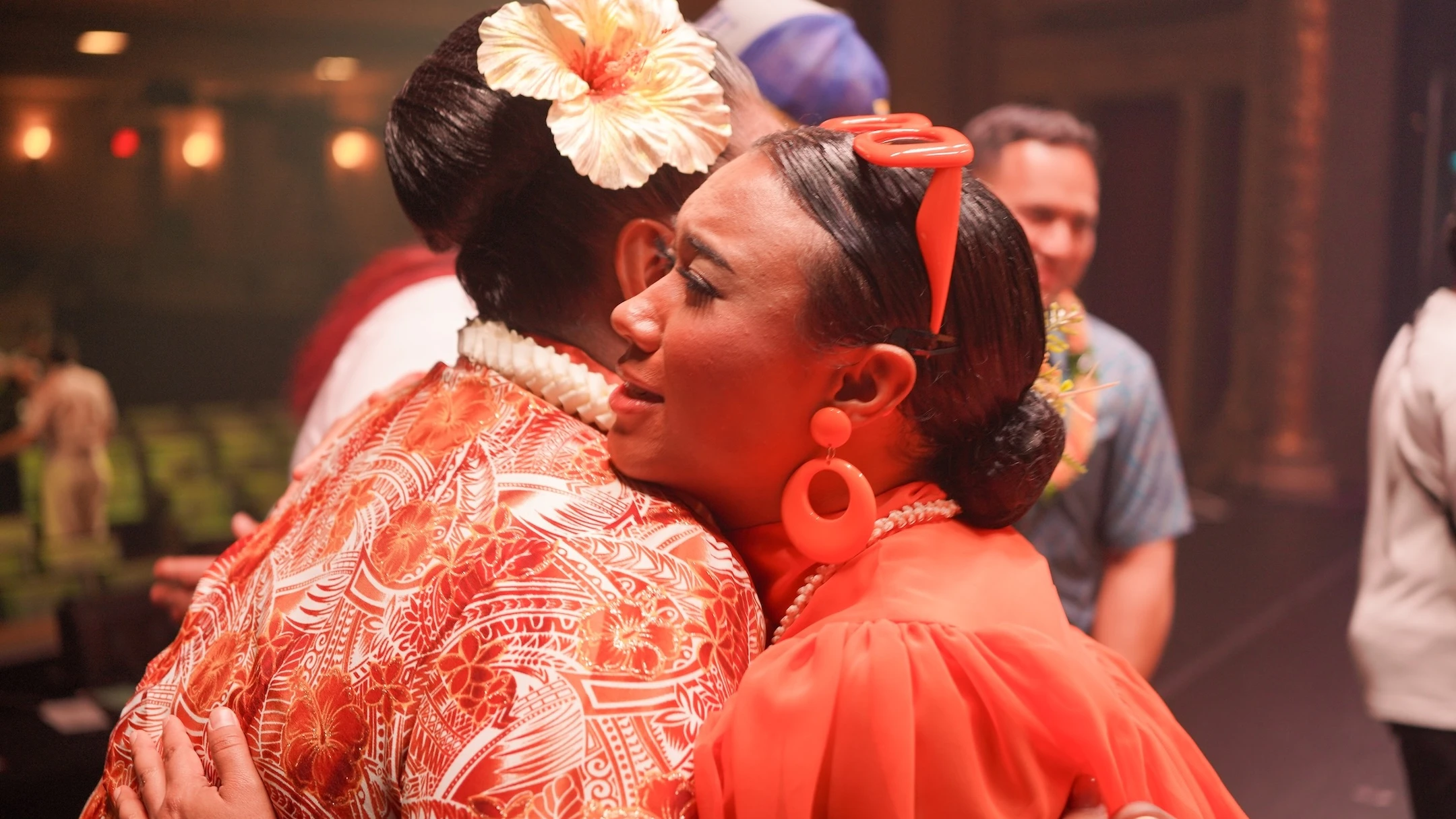 T.J. Keanu Tario, who goes by the stage name Laritza, embraces Kumu Hina, one of the judges of “Hawaiʻi to the World.”