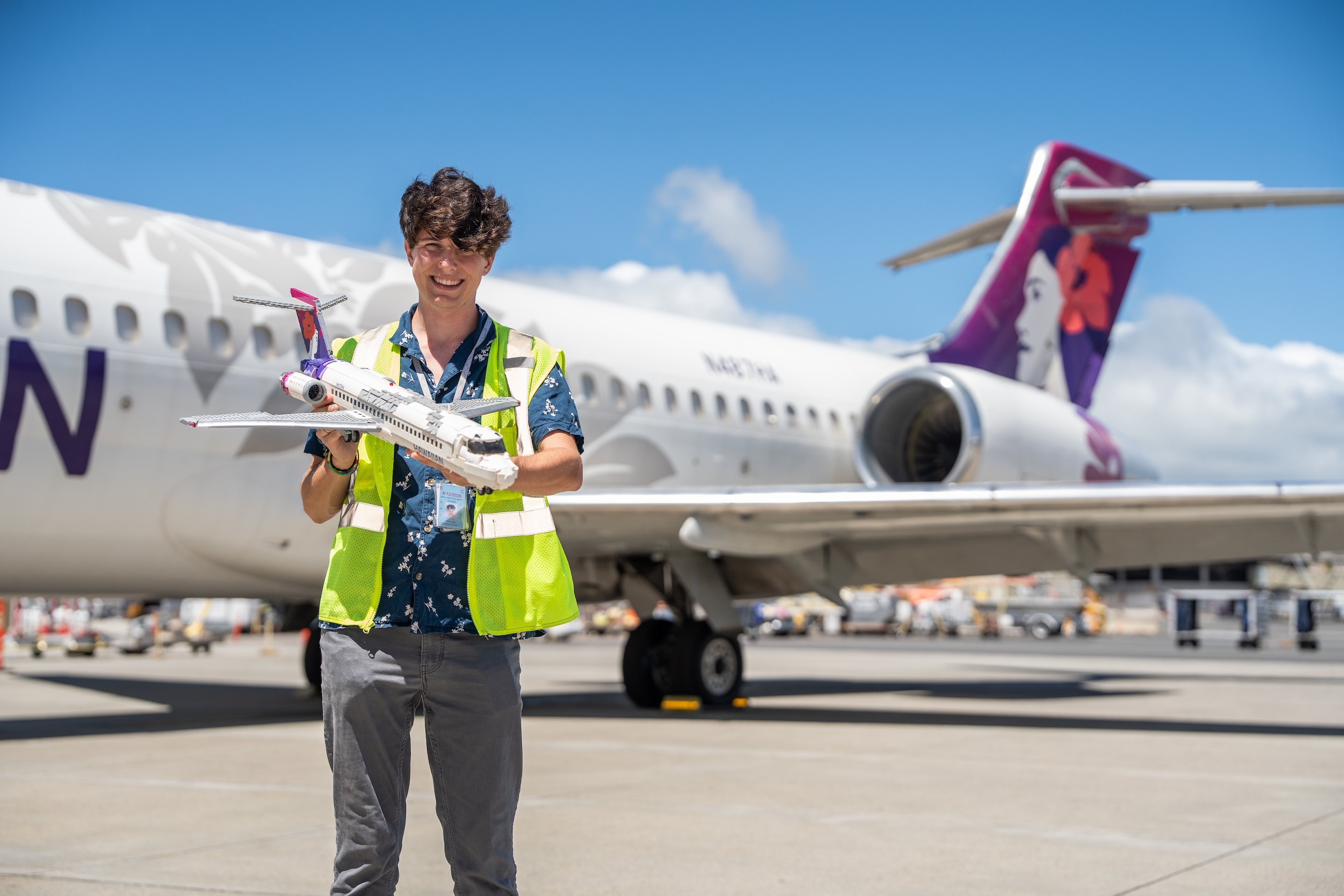 Hawaiian Airlines engineer Ashton Simpkins holds his model of the Boeing 787 Dreamliner, created with Lego bricks.