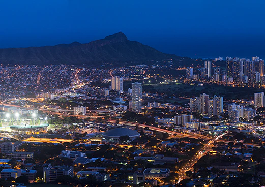 A night photo of a Hawaiian city.