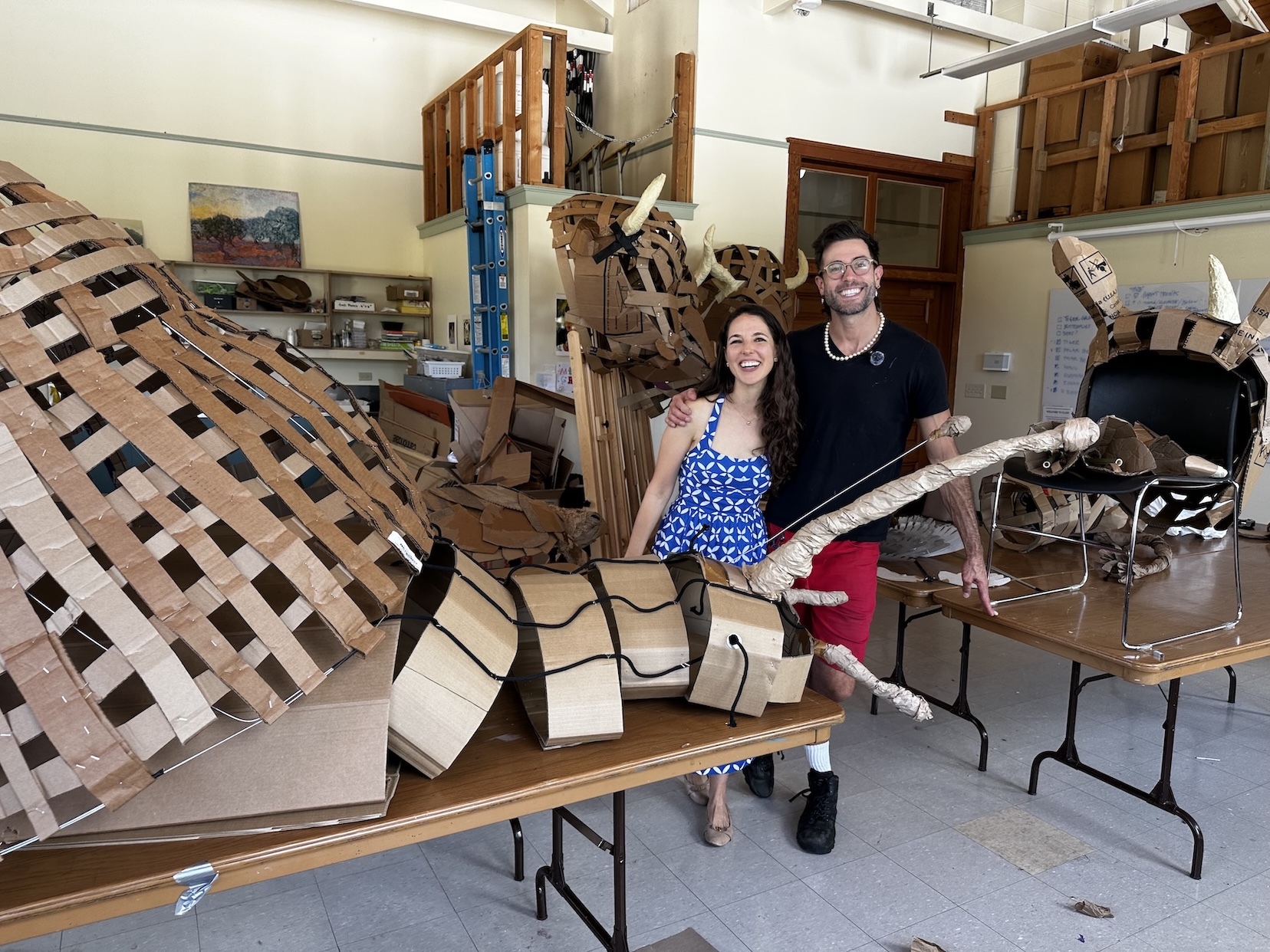 Megan Conley, left, the founder of the nonprofit Ocean Music Action, and Greg Corbino, right, the puppet designer for “Carnival of the Nearly Extinct Animals," who used recycled paper and cardboard to create creatures like this snail.