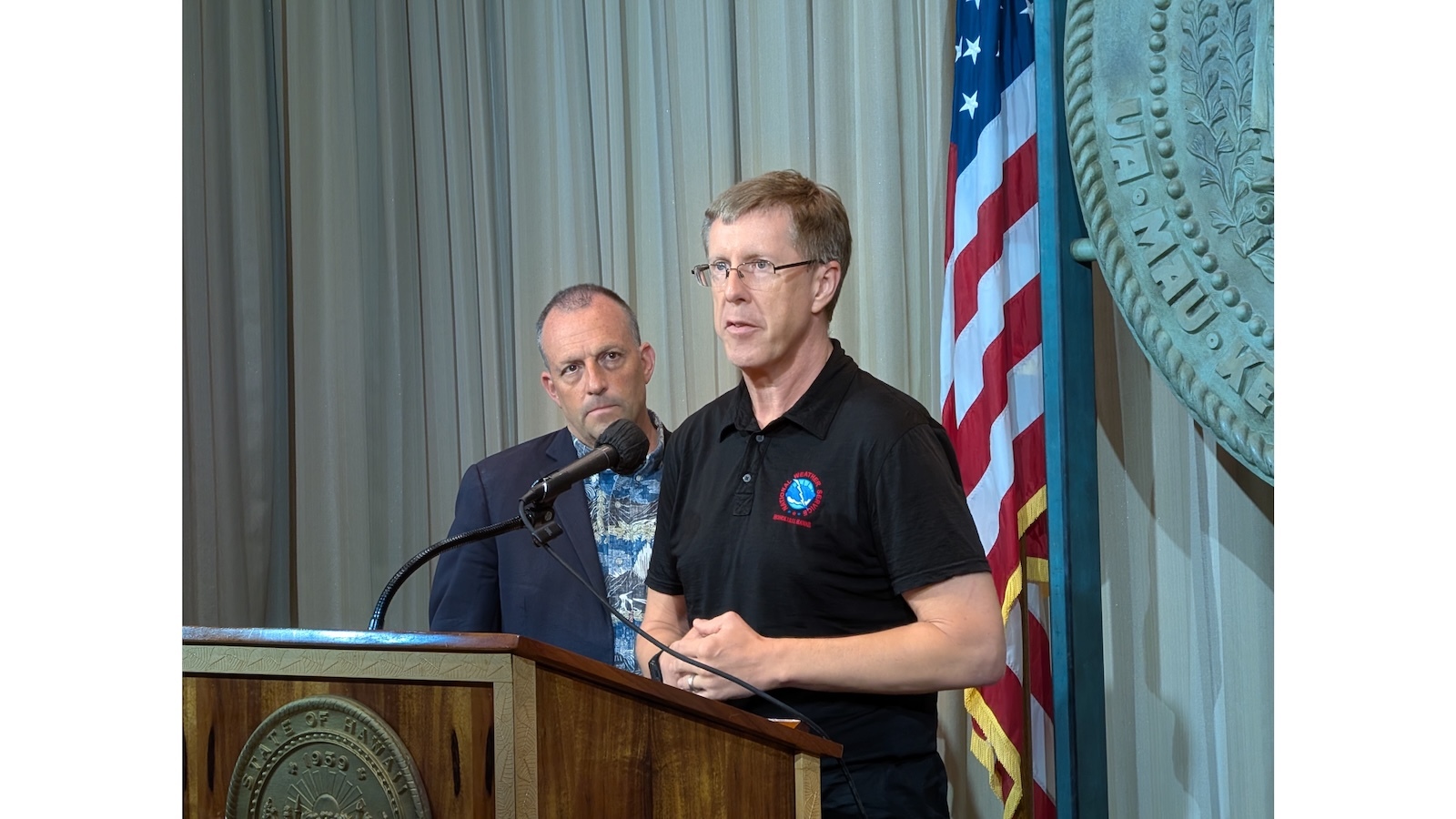 Gov. Josh Green and National Weather Service meteorologist John Bravender.