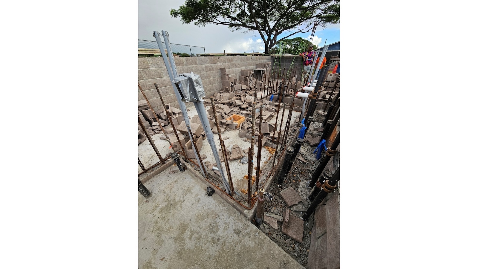 Shattered blocks litter the ground at a Maui High School construction site.