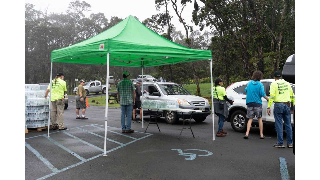 The Volcano Emergency Response Team (VERT) partnering with Vibrant Hawaii hands out drinking water to residents as they face extended power outages in Volcano Village, Hawaii, on August 17, 2026