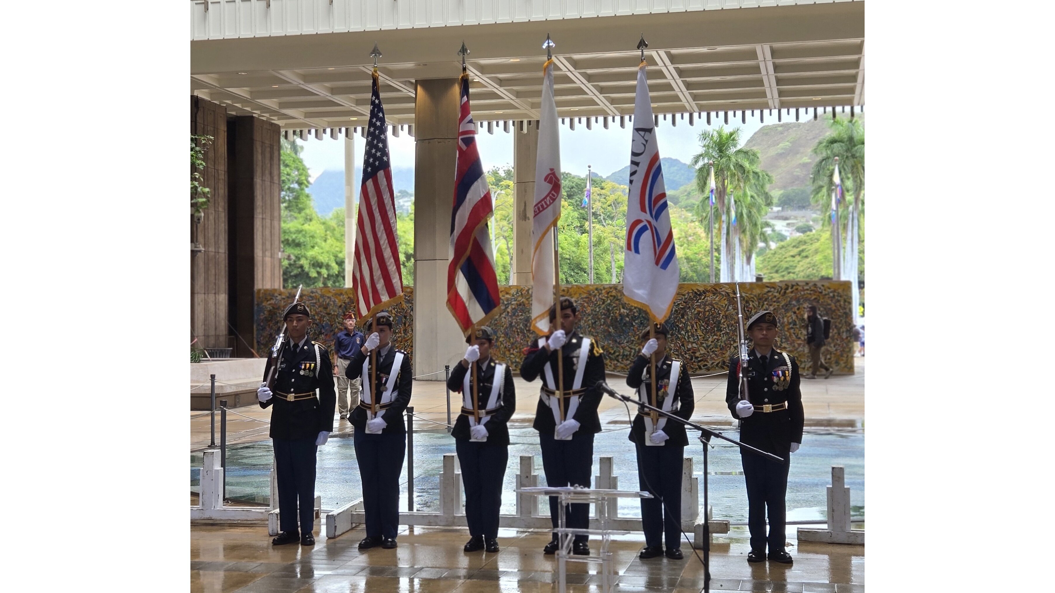 Waipahu Army JROTC Color Guard at the state capitol with one of the America250 flags secured by Hawaiʻi America250. 