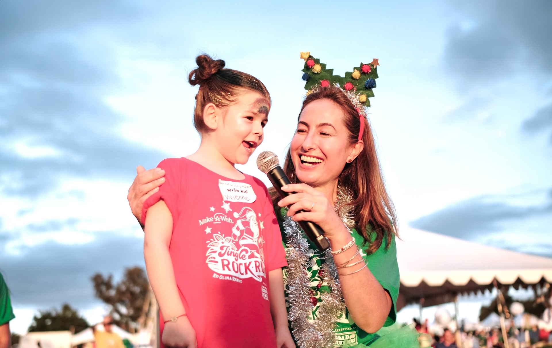 Clark pictured with wish kid, Vivienne, at Jingle Rock Run in 2023.