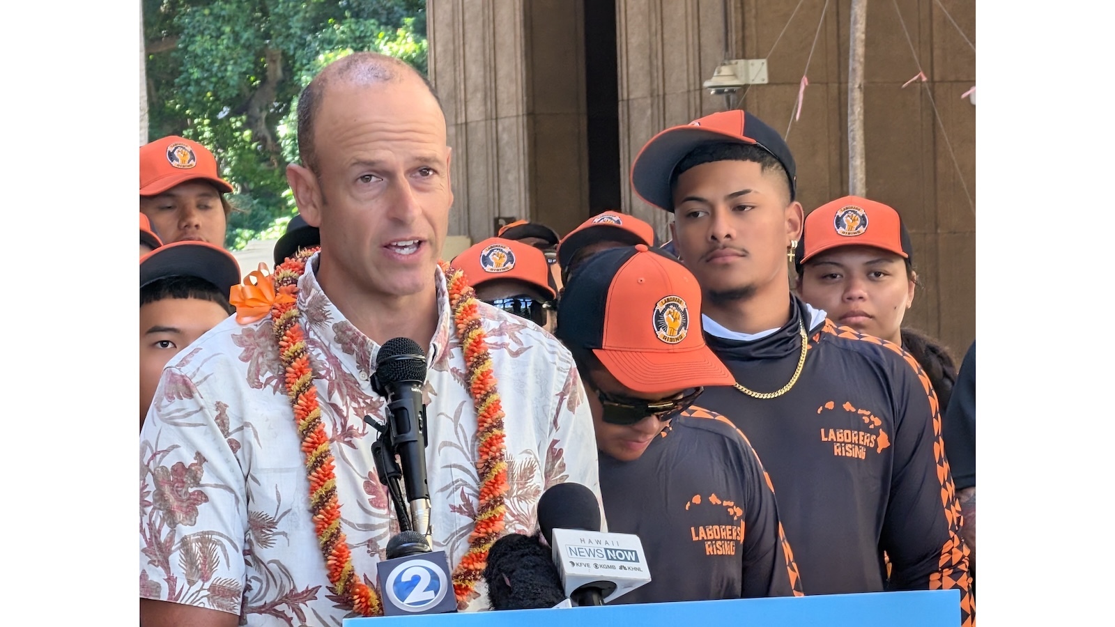 Rep. Luke Evslin speaks at the Capitol Wednesday, with members of the Laborers' International Union of North America behind him.